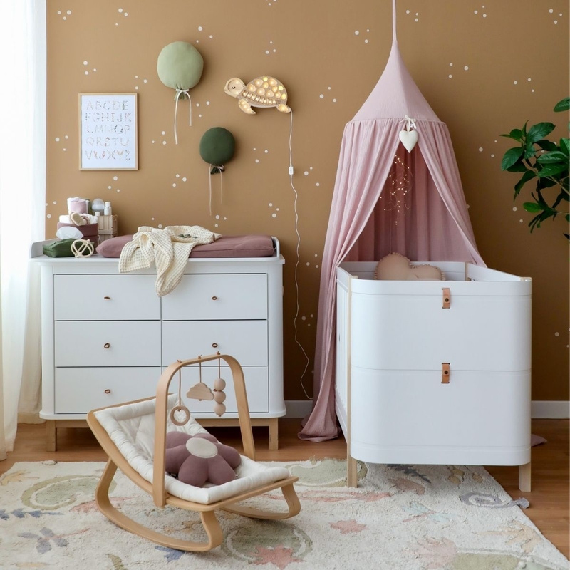 Babyroom With Cozy Decor In Purple, Green &amp; Beige